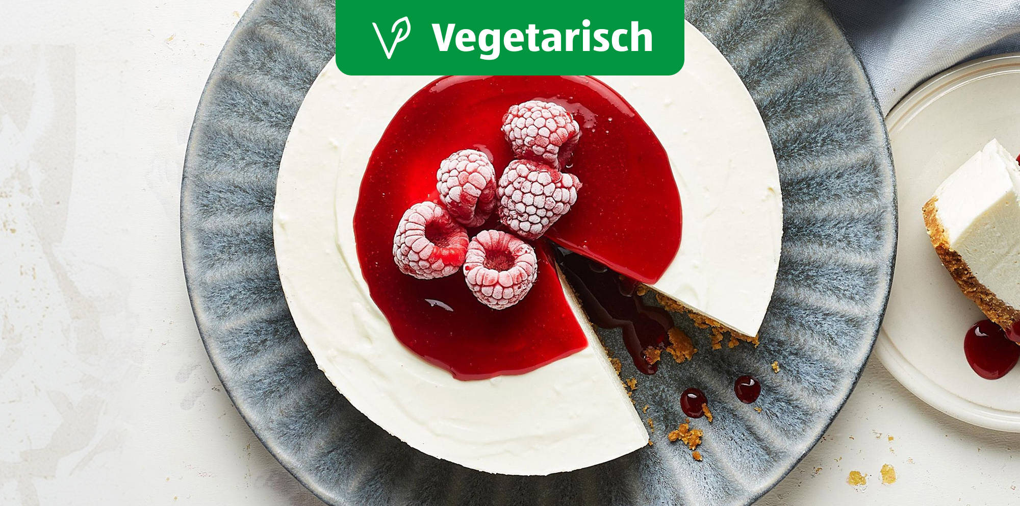 Cheesecake with raspberry sauce topping.