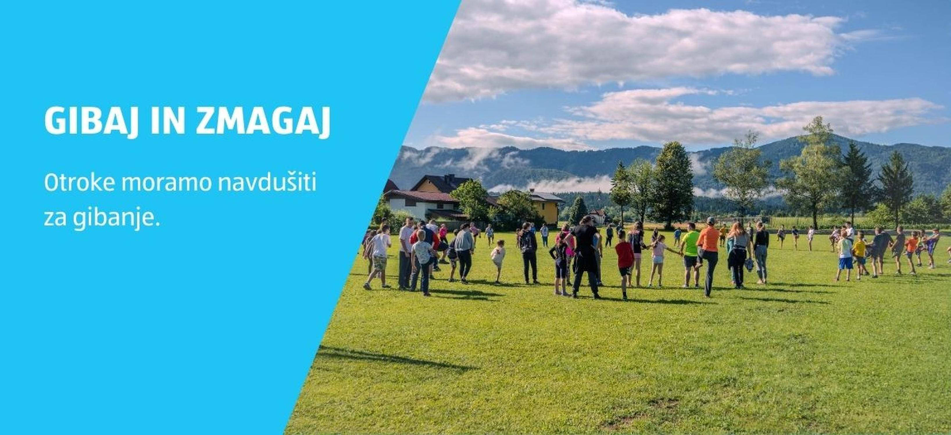 Otroci in štarši se igrajo na travniku, napis: Gibaj in zmagaj