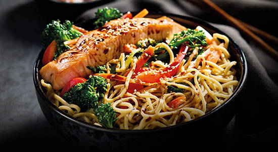 Grilled salmon with protein noodles and vegetables in bowl