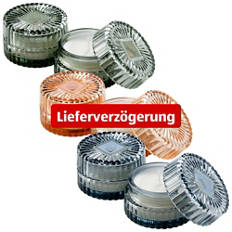 Kerze in geripptem Glas