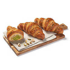 Croissant pisztáciás krémmel töltve és zöld cukordekorációval díszítve, 95 g